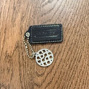 Coach Black leather hangtag with silver circle